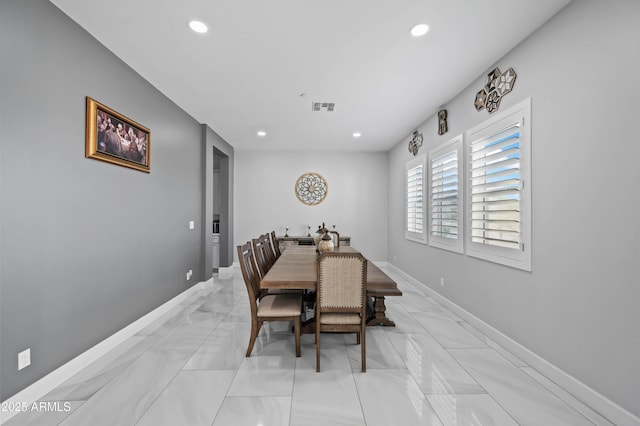 8017 S 143rd Ave, Goodyear, AZ 85338 - dining room with recessed lighting and light marble finish flooring