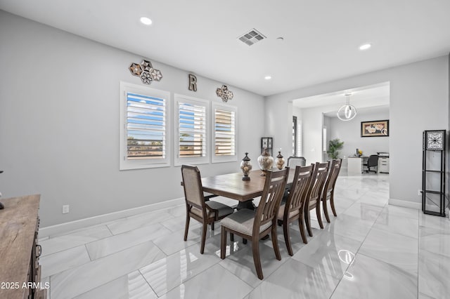 8017 S 143rd Ave, Goodyear, AZ 85338 - dining room with light marble finish flooring, recessed lighting, and an office area