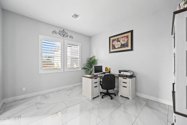 8017 S 143rd Ave, Goodyear, AZ 85338 - office area featuring baseboards and light marble finish flooring