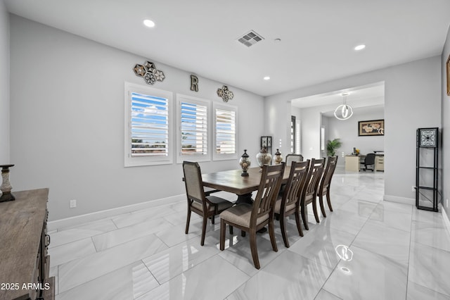 8017 S 143rd Ave, Goodyear, AZ 85338 - dining area featuring light marble finish floors and recessed lighting