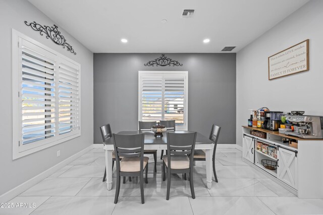 8017 S 143rd Ave, Goodyear, AZ 85338 - dining room featuring light marble finish floors and recessed lighting