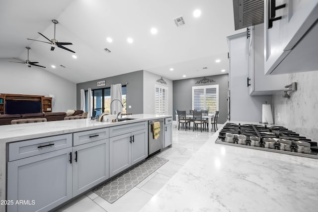 8017 S 143rd Ave, Goodyear, AZ 85338 - kitchen with appliances with stainless steel finishes, a ceiling fan, open floor plan, vaulted ceiling, and recessed lighting