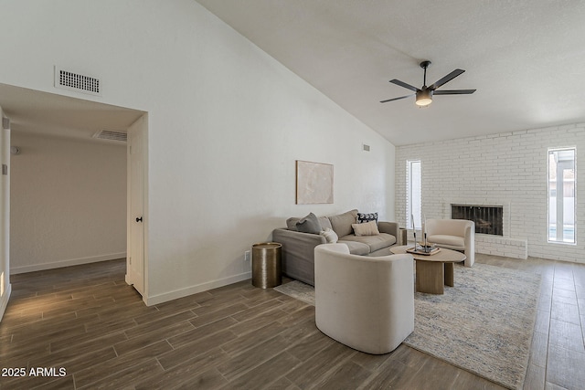 2307 W Nido Ave, Mesa, AZ 85202 - living room featuring high vaulted ceiling, dark wood finished floors, ceiling fan, baseboards, and a brick fireplace