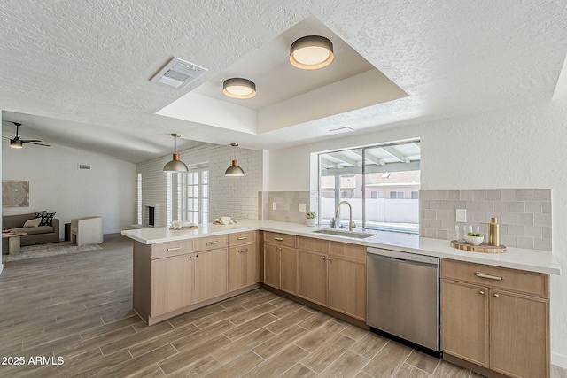 2307 W Nido Ave, Mesa, AZ 85202 - kitchen with stainless steel dishwasher, a sink, a peninsula, open floor plan, and light countertops