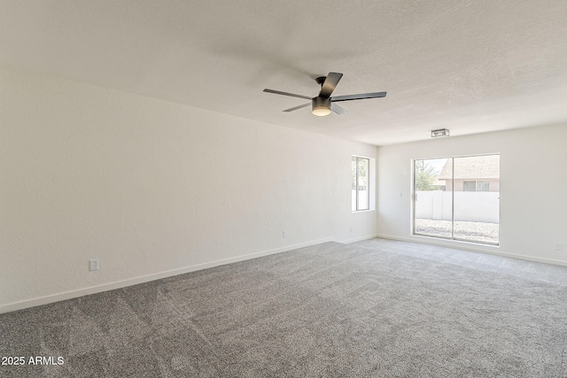 2307 W Nido Ave, Mesa, AZ 85202 - spare room featuring a ceiling fan, carpet flooring, baseboards, and a textured ceiling