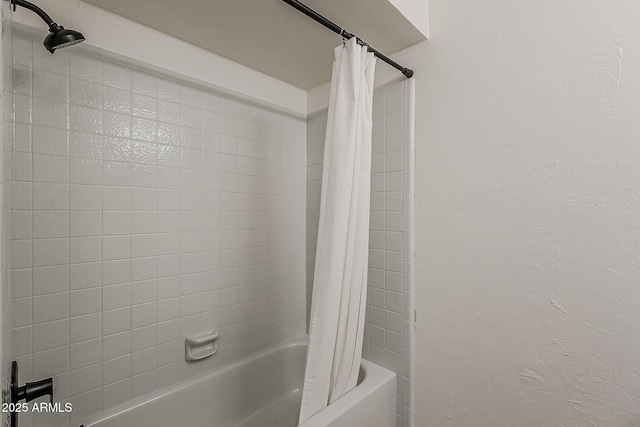 2307 W Nido Ave, Mesa, AZ 85202 - bathroom featuring shower / bath combo with shower curtain and a textured wall