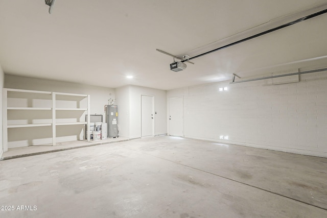 2307 W Nido Ave, Mesa, AZ 85202 - garage featuring a garage door opener, electric water heater, and concrete block wall