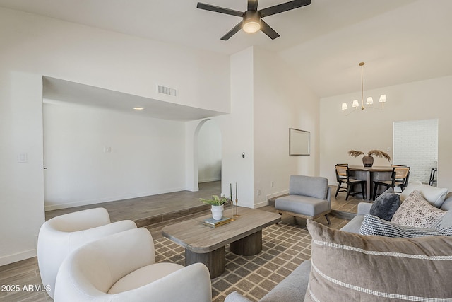 2307 W Nido Ave, Mesa, AZ 85202 - living area with a chandelier, arched walkways, ceiling fan, wood finished floors, and high vaulted ceiling
