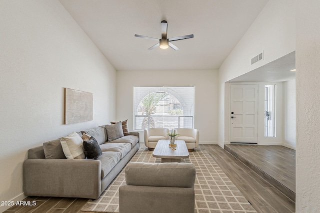 2307 W Nido Ave, Mesa, AZ 85202 - living room featuring wood finished floors, ceiling fan, baseboards, and vaulted ceiling