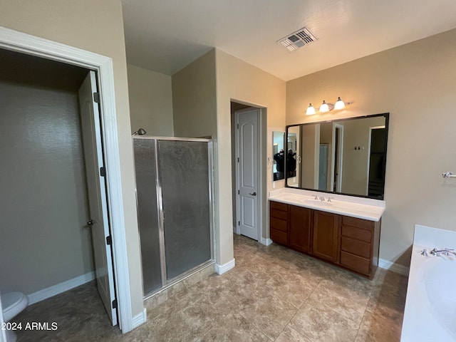 bathroom featuring vanity and shower with separate bathtub