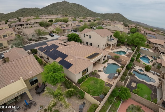 birds eye view of property featuring a mountain view