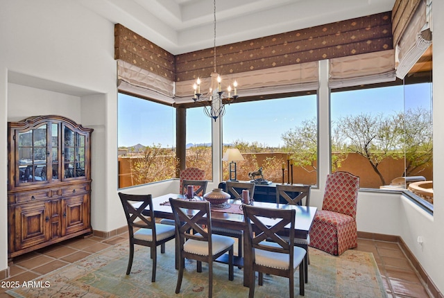 interior space with baseboards and an inviting chandelier