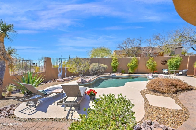 view of pool with a patio area, a fenced in pool, and a fenced backyard