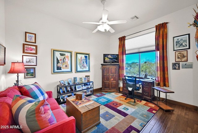 living area featuring a ceiling fan, wood finished floors, visible vents, and baseboards