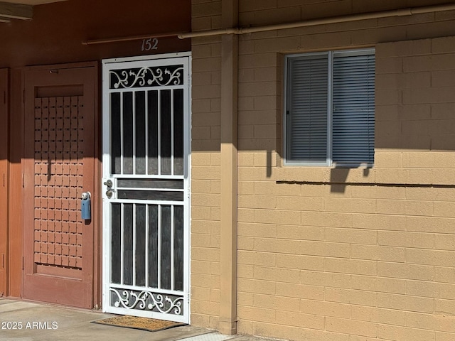 6125 E Indian School Rd Unit 152, Scottsdale, AZ 85251 - view of exterior entry with concrete block siding