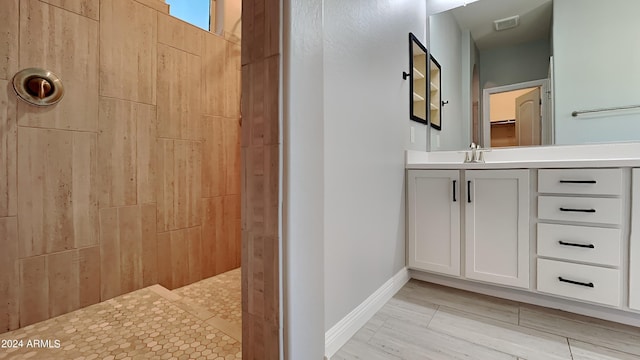 bathroom with tile flooring and vanity