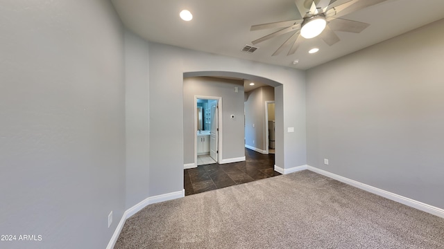 carpeted empty room featuring ceiling fan