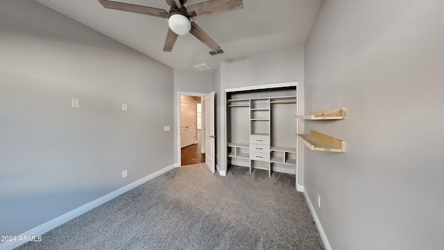 unfurnished bedroom with a closet, ceiling fan, and dark carpet