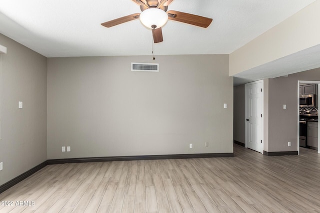 unfurnished room featuring ceiling fan and hardwood / wood-style floors