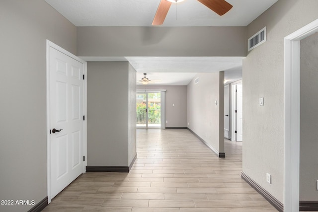 hall with light wood-type flooring