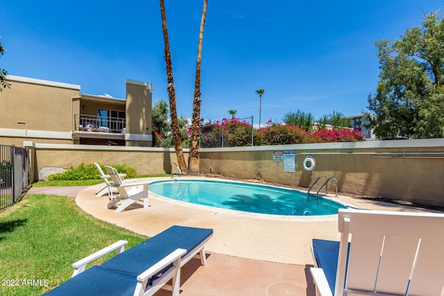 view of swimming pool with a patio