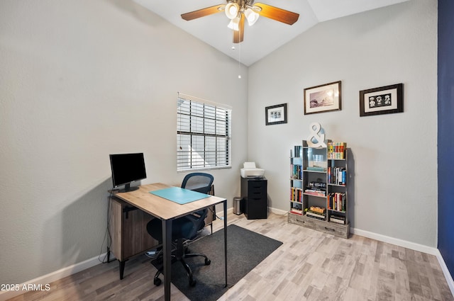 office area featuring ceiling fan, light hardwood / wood-style floors, and lofted ceiling