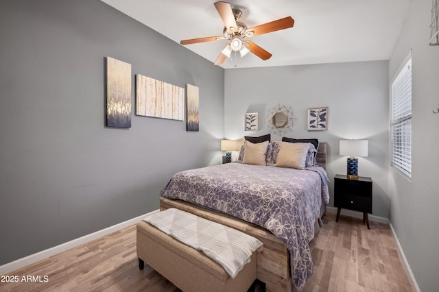 bedroom featuring hardwood / wood-style floors and ceiling fan