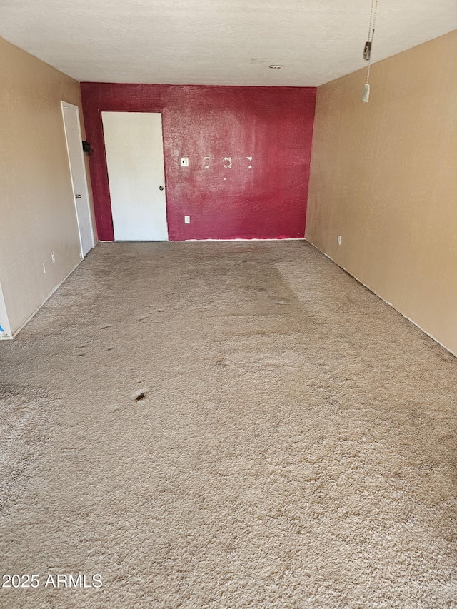 empty room featuring carpet