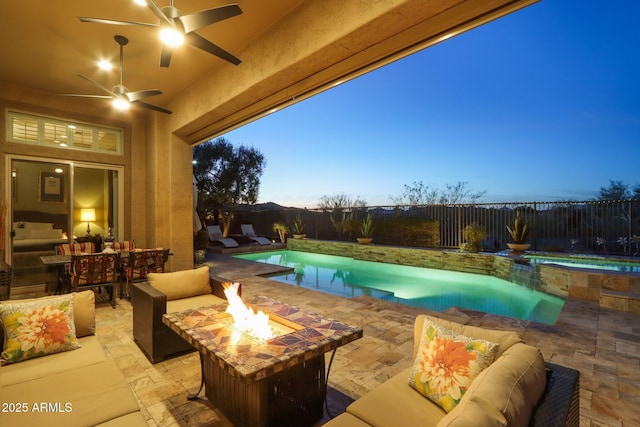 view of pool with an outdoor living space with a fire pit, a patio, a fenced backyard, and a fenced in pool