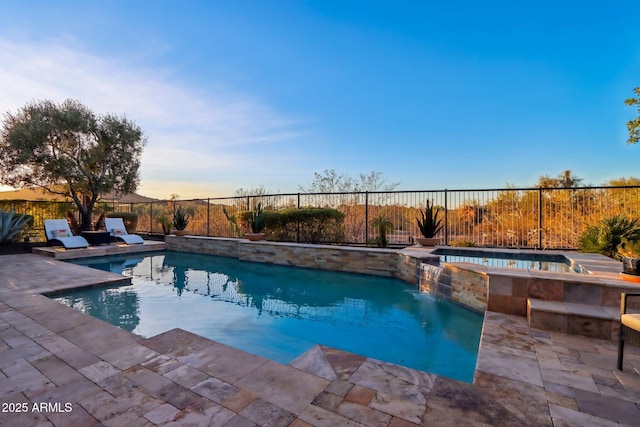 view of pool featuring an in ground hot tub and a patio