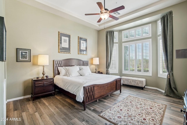 bedroom with wood-type flooring and ceiling fan