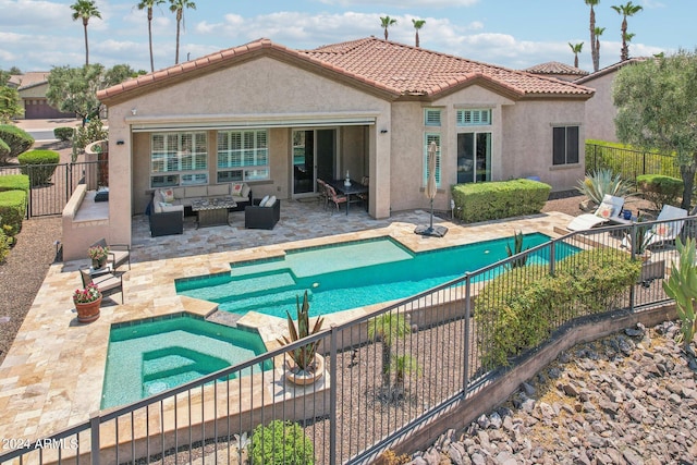 back of house featuring a fenced in pool, a patio, a fenced backyard, an outdoor hangout area, and stucco siding