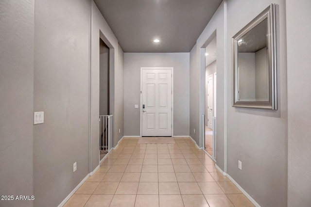 corridor with light tile patterned flooring