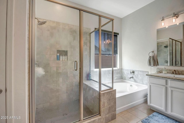 bathroom with separate shower and tub, vanity, and tile patterned floors