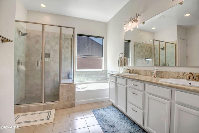 bathroom featuring tile patterned floors, vanity, and separate shower and tub