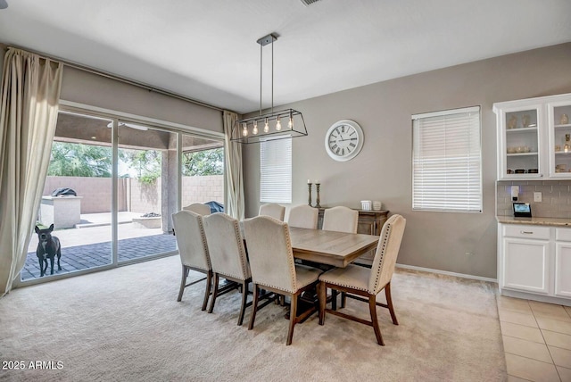 view of carpeted dining area