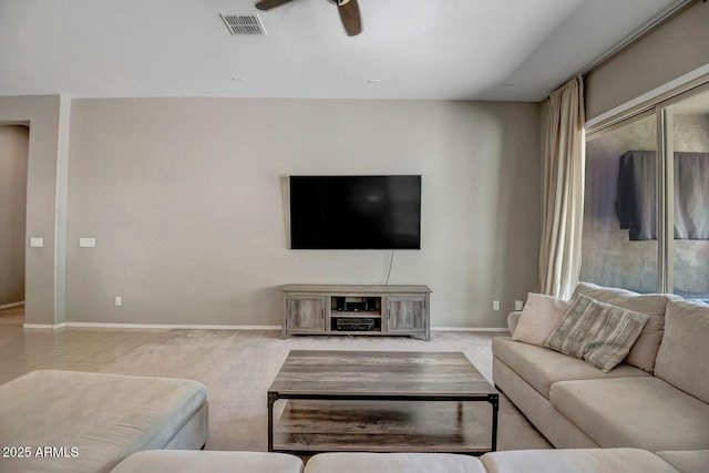 living room with light carpet and ceiling fan