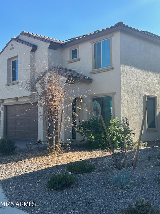 view of front of property featuring a garage