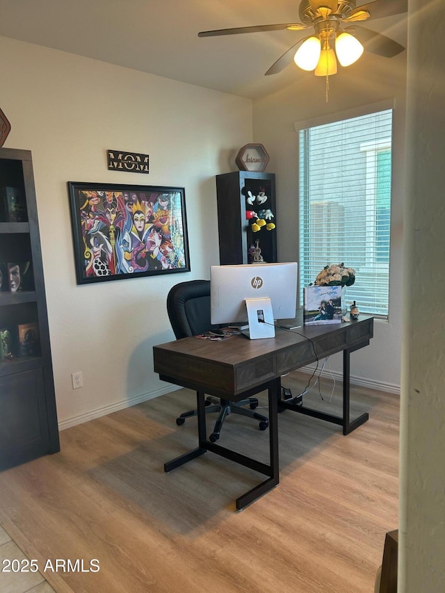 office area with light wood-type flooring and ceiling fan