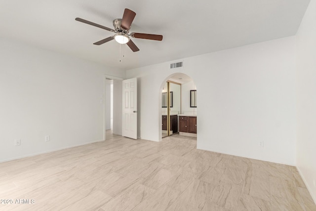 unfurnished room with ceiling fan