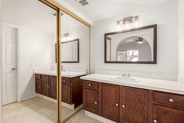 bathroom featuring vanity and ceiling fan