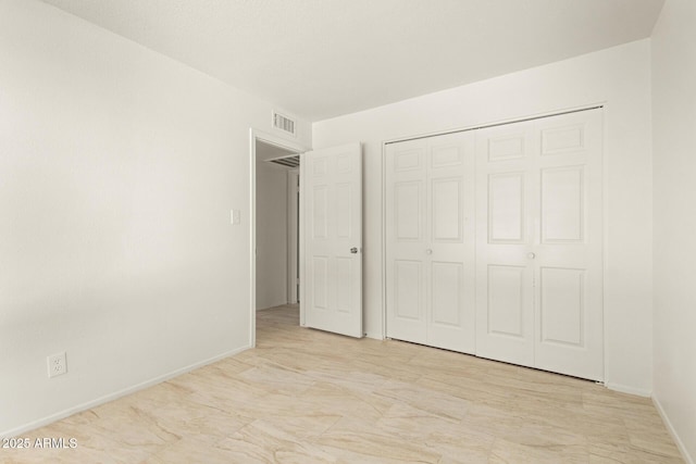 unfurnished bedroom with a closet