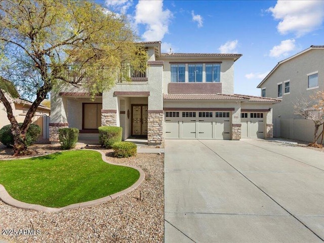 view of front of home featuring stucco siding, a garage, stone siding, driveway, and a tiled roof