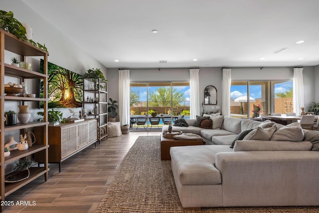 2037 E Fallen Leaf Ln, Phoenix, AZ 85024 - living room featuring dark wood-style flooring and recessed lighting