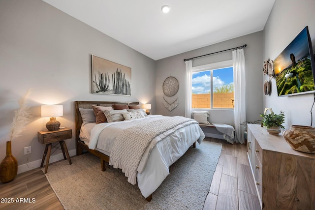 2037 E Fallen Leaf Ln, Phoenix, AZ 85024 - bedroom featuring wood finished floors and baseboards