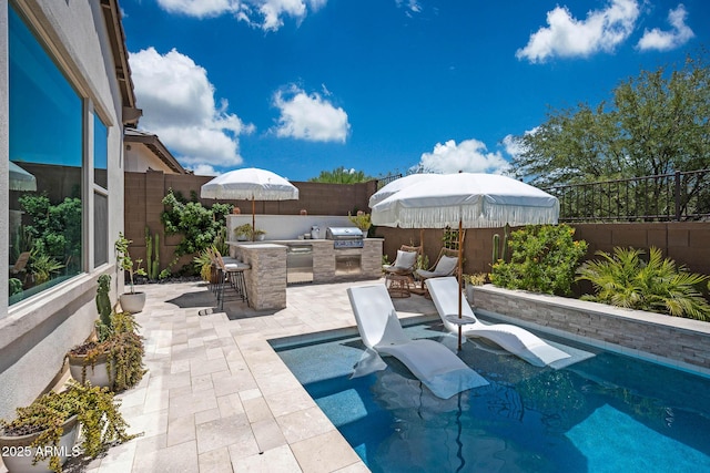 2037 E Fallen Leaf Ln, Phoenix, AZ 85024 - view of swimming pool featuring an outdoor kitchen, a patio, and a fenced backyard