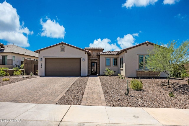 2037 E Fallen Leaf Ln, Phoenix, AZ 85024 - mediterranean / spanish house with stucco siding, a tiled roof, decorative driveway, and an attached garage