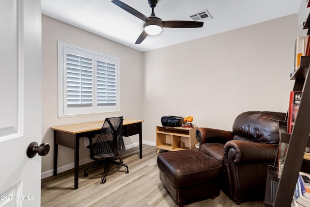 office with light hardwood / wood-style floors and ceiling fan