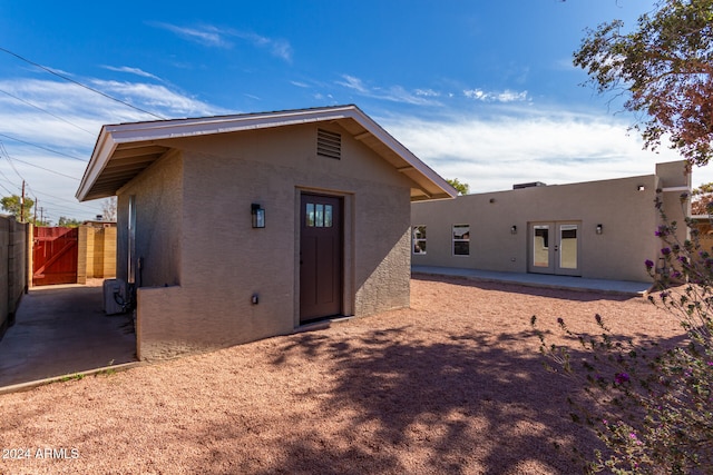 back of property featuring french doors