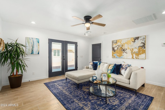 living room with french doors, light hardwood / wood-style flooring, and ceiling fan